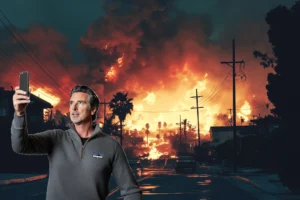 Governor Newsome taking a selfie in front of wildfires wearing Patagonia