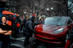 Musk grinning as protester vandalizes Tesla